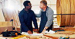 Conversation, men and woodworker with customer in workshop for furniture production planning. Industry, talking and artisan with client for furniture manufacturing with timber material in warehouse.