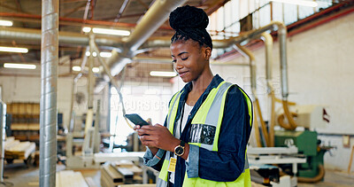 Buy stock photo Phone, woman and engineer in factory for stock, storage or text for furniture production. African worker, technology and carpenter in warehouse for manufacturing, woodwork or check inventory online