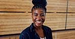 Woman, portrait and happy with wood at warehouse, pride and ready for career at lumber plant. African person, smile and job with timber production, manufacturing and industry at factory in Nigeria