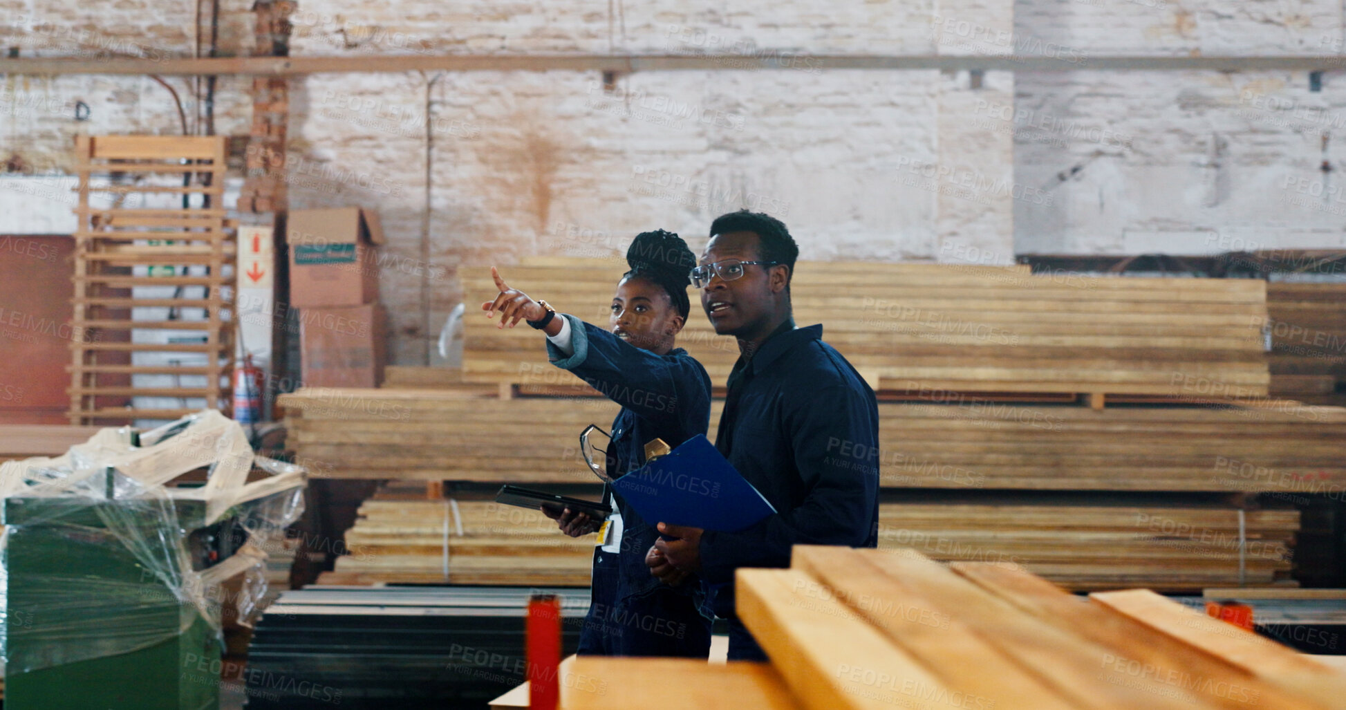 Buy stock photo Man, woman and discussion at factory with wood, point and inventory inspection with team at plant. Black people, talk and checklist for quality assurance, industry and tablet with manufacturing job