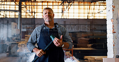 Buy stock photo Demolition, hammer and portrait of man in construction industry for building remodel. Contractor, renovation and tool with serious mature person in factory or warehouse for lumber occupation