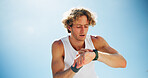 Tired, outdoor and man with fitness, smart watch and track progress with space, blue sky and exercise. Person, runner and athlete with training, check cardio and break with wellness and challenge
