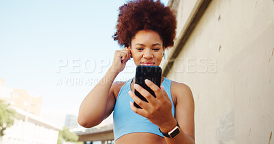 Buy stock photo Fitness, music and woman on break in city for running, outdoor workout or training motivation. Playlist, earphones or confident runner with song audio for sports routine, exercise video or wellness