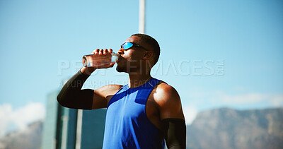 Buy stock photo Fitness, sports and black man drinking water in city on break, relax and exercise recovery. Workout, hydration bottle and thirsty athlete outdoor for wellness, body health and electrolytes for diet