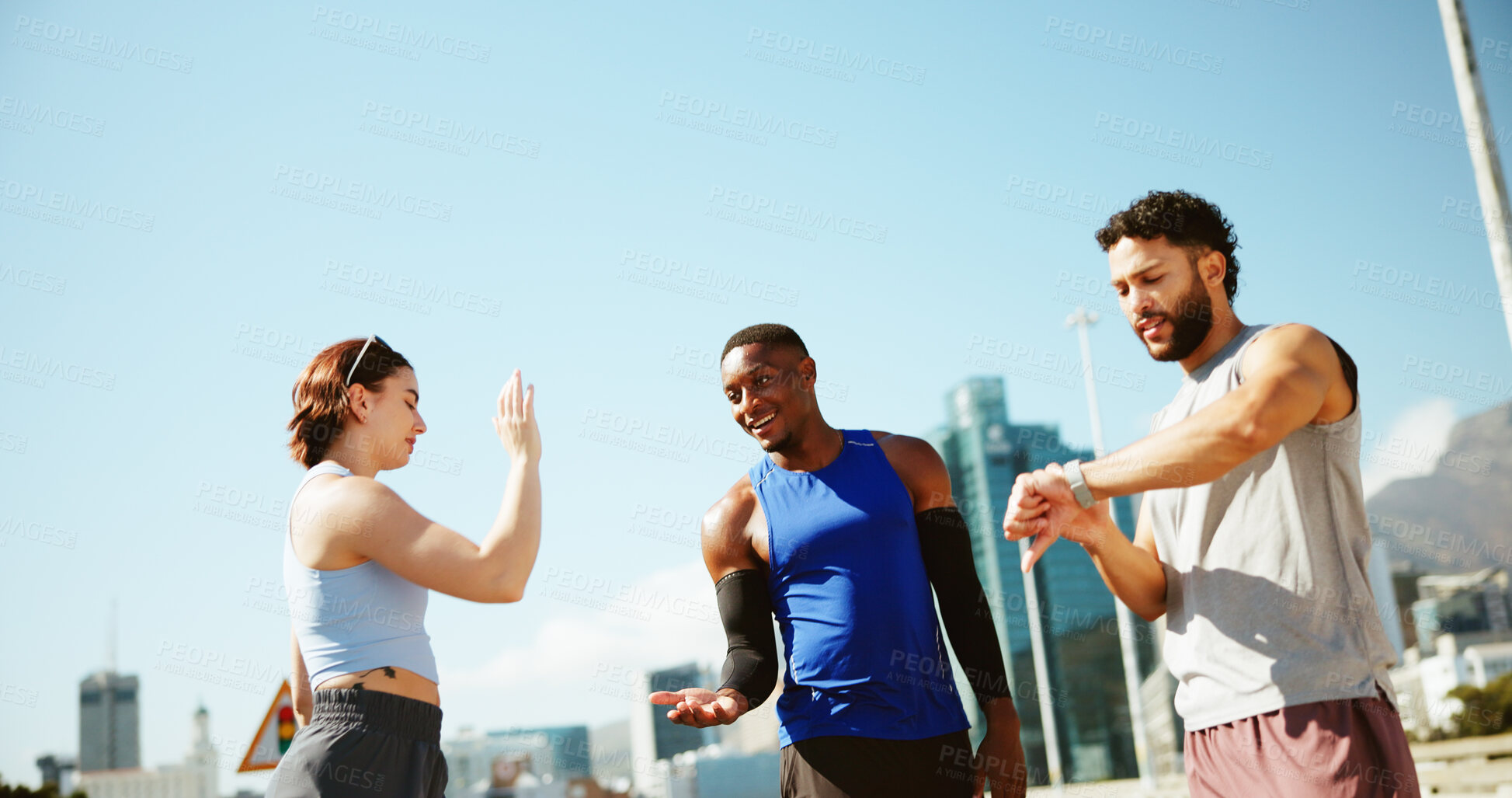 Buy stock photo Fitness, people and high five in city for finished, team achievement and check time. Personal trainer, man and woman at outdoor space with hand gesture, training goal and smart watch timer in session