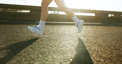 Buy stock photo Bridge, fitness and legs of athlete running in city for race, marathon or training for speed. Sports, outdoor and feet of person on highway with cardio workout, challenge or exercise in town.