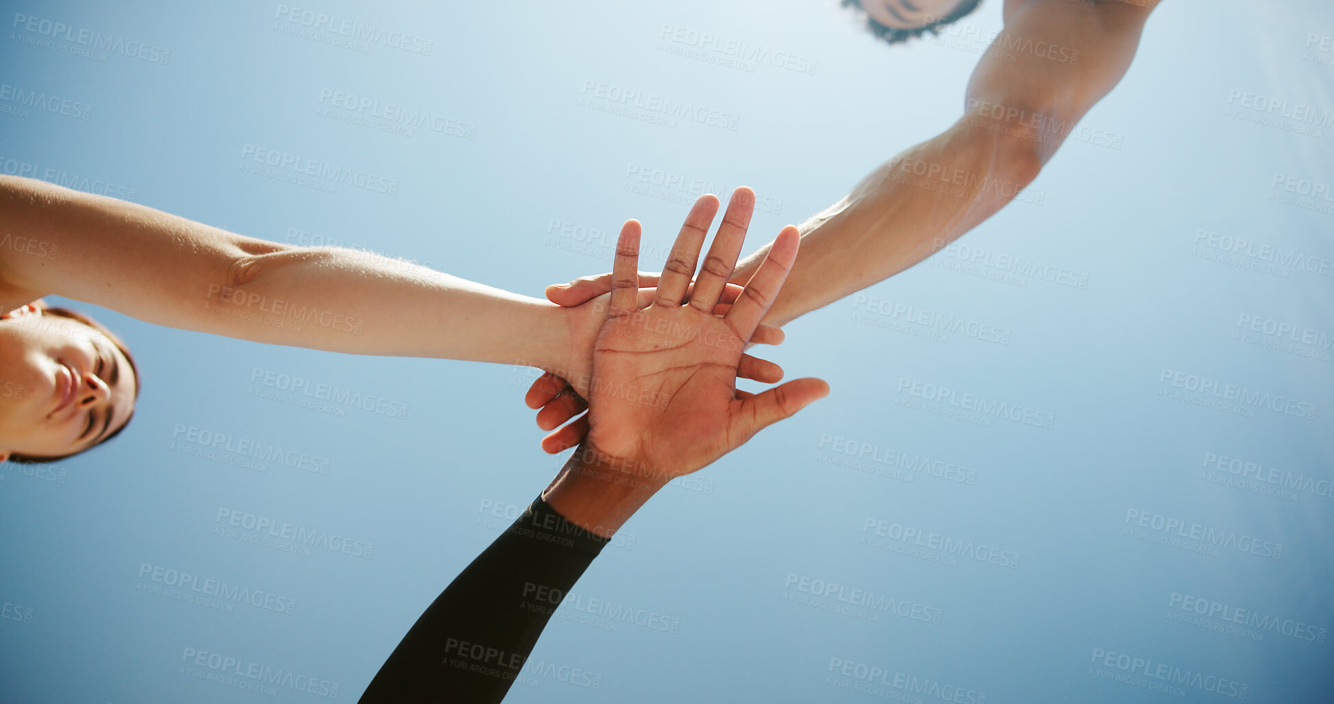 Buy stock photo Fitness, people and hands together below with huddle for motivation, teamwork or unity under blue sky. Low angle, active group or friends piling with stack in solidarity for mission or coordination