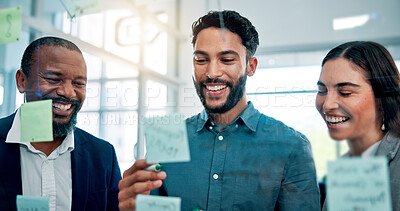 Buy stock photo Collaboration, glass wall and laughing with business people in office for brainstorming or strategy. Conversation, ideas or sticky notes with funny employee team in workplace for development