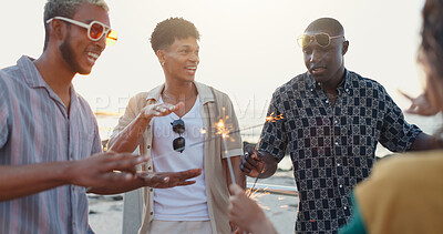 Buy stock photo Beach, friends and dance with sparklers for holiday, social gathering and new year party. Celebration, firework stick and group of happy people outdoor for travel, summer vacation and laughing at sea
