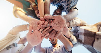 Buy stock photo Hands stack, low angle and group of friends outdoor with community, collaboration or support. Circle, bonding and people with palms together for solidarity, goals or target in huddle from below.