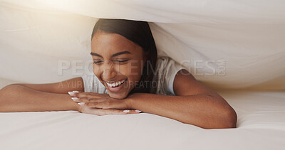Buy stock photo Blanket, laugh and woman in bed for relax, happiness or thinking of funny memory with thoughts. Under cover, sheet and person in bedroom with comfort for dream, smile or morning rest on break in home