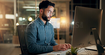 Buy stock photo Night, business man and typing on computer for email, report or compliance officer on deadline. Keyboard, writing and serious worker reading research, regulations and policy development in office