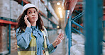 Woman, phone call and talk at warehouse for supply chain with deal for order, networking or job at distribution center. Person, smartphone and logistics by shelf, shipping or contact at storage plant