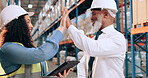 Man, woman and high five for logistics at warehouse, smile and success with motivation, team and tablet. People, mentor and happy with cheers, celebration and goals for supply chain at storage plant