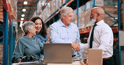 Buy stock photo Business people, laptop and handshake in warehouse for logistics, meeting for supply chain collaboration. Import team, tech or shaking hands in storage for export deal, service agreement or welcome