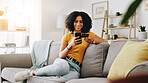 Credit card, happy and woman on sofa with phone for online shopping, web store sale and purchase. Home, relax and person on smartphone for internet payment, digital order and ecommerce in living room
