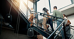 Walking, discussion and business people on stairs in office for meeting, talking and planning. Creative startup, professional and men and women in conversation, speaking or chat for coworking project