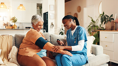 Buy stock photo Nurse, elderly woman and blood pressure test on sofa with healthcare assessment with smile in living room. People, caregiver and monitor for medical results, helping hand and check on couch in house