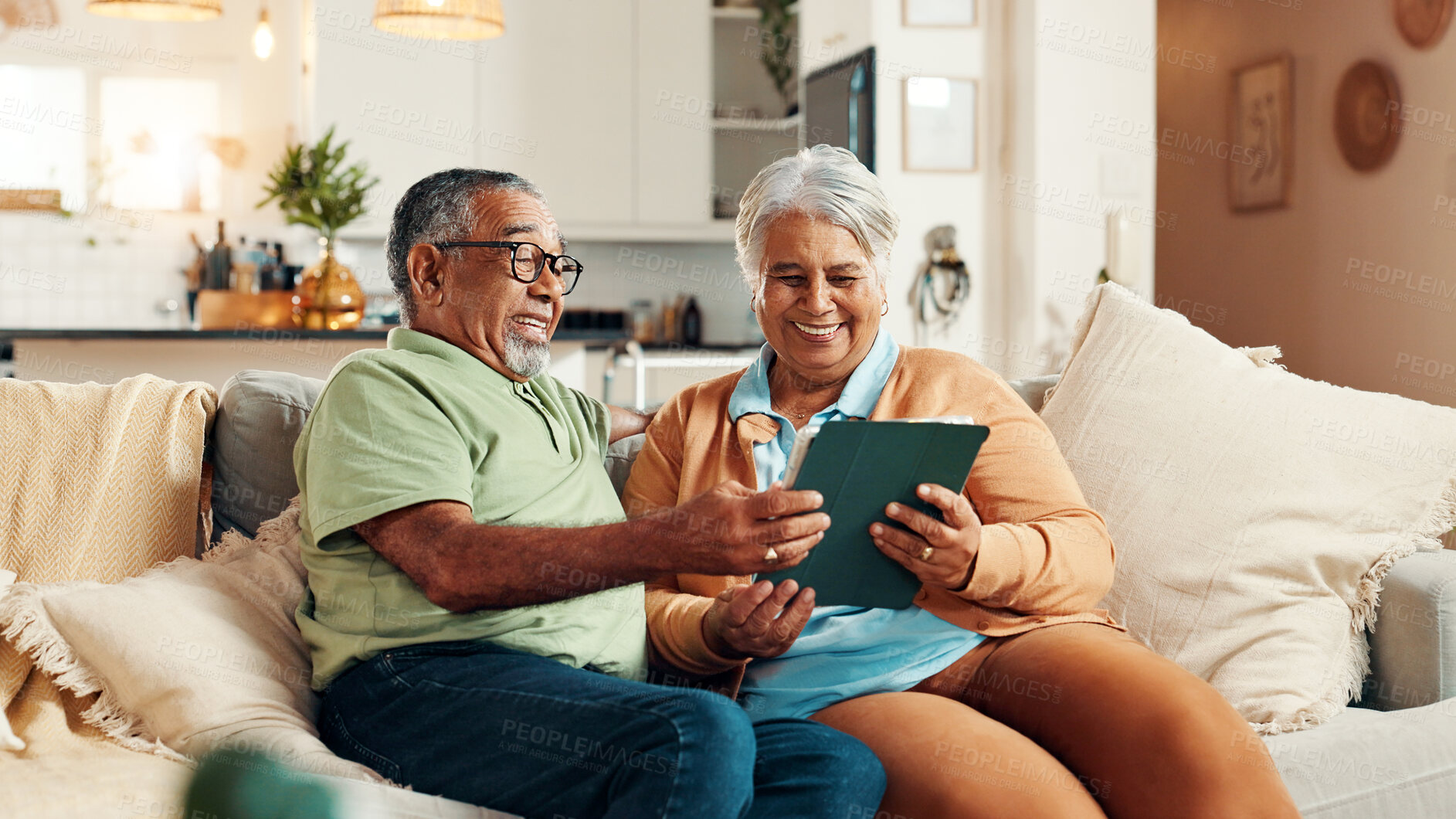 Buy stock photo Tablet, laughing and senior couple on sofa for reading, online news or together in morning. Happy, digital tech and elderly man with woman for scrolling on app with bonding in living room in home.