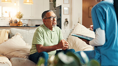 Buy stock photo Nurse, senior man and tablet in retirement for report with medical results, feedback or stress for bad news. Caregiver, elderly person and worry with digital touchscreen, app or consultation in home
