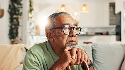 Buy stock photo Sad, old man and thinking with cane in home for retirement stress, regret or nostalgia with daydreaming. Lonely, mental health and elderly person with walking stick on sofa for reflection or dementia