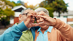 Heart, hands and senior couple outdoor with connection, love and bonding together in neighborhood. Elderly people, closeup and romantic symbol for marriage commitment, relationship or retirement date