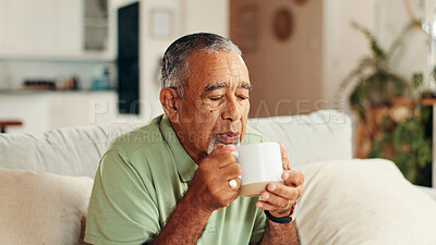 Buy stock photo Home, coffee and senior man on sofa, blowing and relaxing with retirement in living room. Warm drink, pensioner and elderly person on couch, herbal tea or morning with hot chocolate, wellness or calm