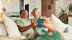 Tablet, laughing and senior couple in home reading online news together in morning. Happy, digital technology and elderly man with woman for scrolling on app with bonding in living room in house.
