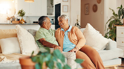Buy stock photo Conversation, relax and senior couple on sofa in home for bonding, love and connection on weekend. Happy, talking and elderly man with woman in living room for marriage with retirement in house.