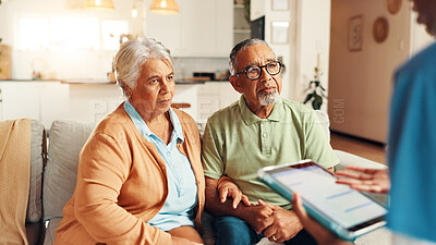 Buy stock photo Nurse, senior couple and tablet on sofa for report with medical results, feedback or worry for diagnosis. Caregiver, elderly man and woman with digital touchscreen, app or consultation in retirement