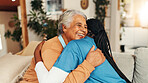 Hug, kindness and nurse with old woman on sofa for healthcare advice, support and trust. Medical caregiver, retirement and consulting with senior patient in nursing home for help and elderly care
