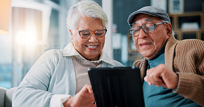 Buy stock photo Senior couple, tablet and laugh on couch in home with meme, notification or funny video on web in lounge. Elderly man, woman and relax with touchscreen, joke or comic movie in retirement at apartment
