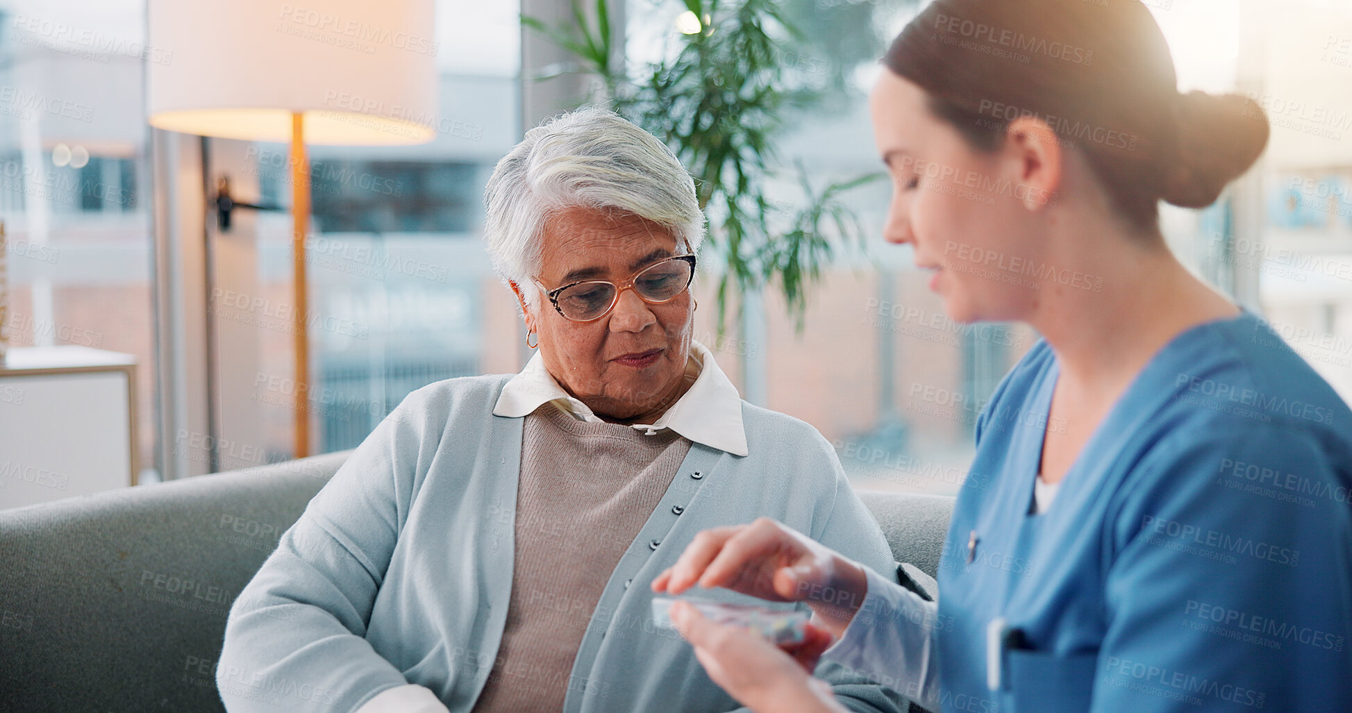 Buy stock photo Home, old woman and nurse with pills, help and conversation with advice, medical talk and container. Apartment, caregiver and professional with elderly patient, tablets and retirement with health