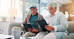 Senior couple, tablet and clipboard at house for finance planning, review bills and payment checklist. Elderly people, digital and document for investment, insurance application and asset management