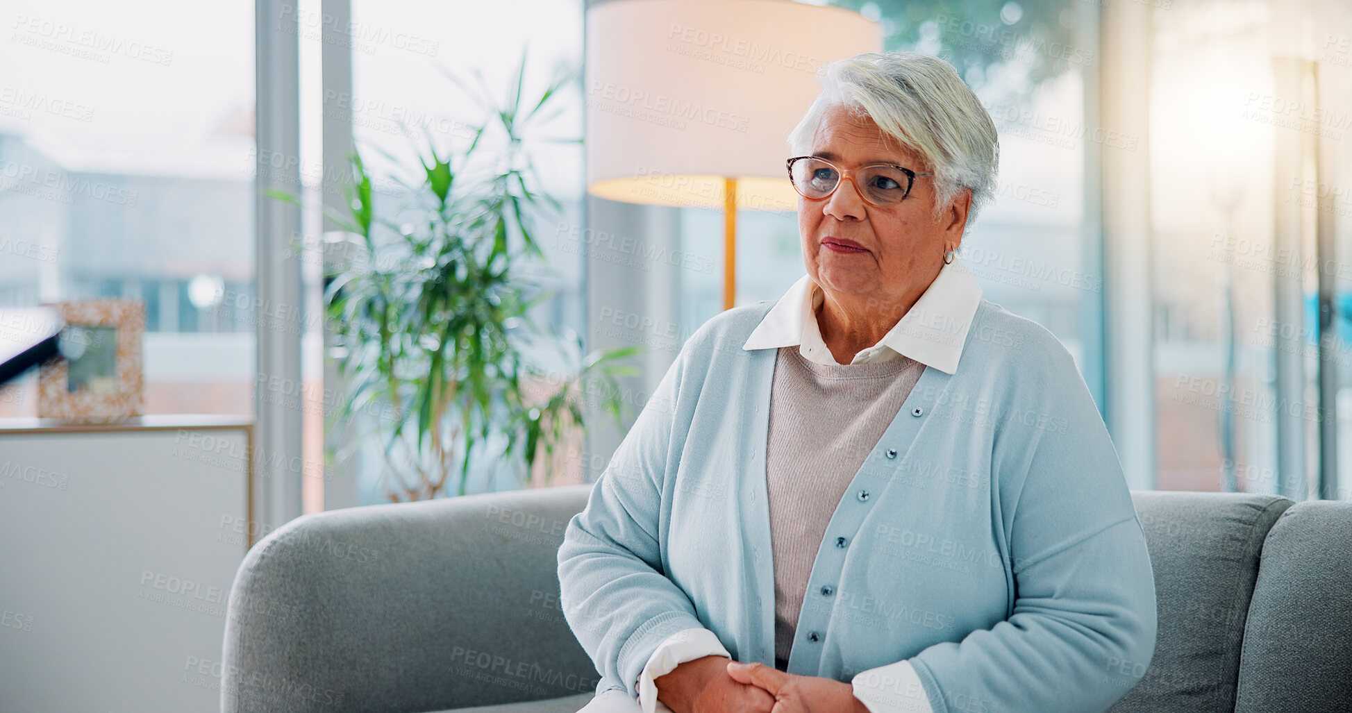 Buy stock photo Relax, retirement and thinking with senior woman on sofa in living room of home for memories or nostalgia. Future, ideas and vision with old person in apartment for contemplation or reflection