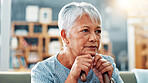 Old woman, thinking or regret on sofa in house for nostalgia, past or history with lonely pensioner in retirement. Mistake, reflection or memory with grief, loss or contemplating life in nursing home