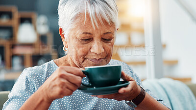 Buy stock photo Calm, drinking and senior woman with coffee on sofa for relax, peace and morning routine. Happy, cappuccino and elderly female person enjoying cup of tea on couch in living room at retirement home.