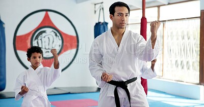 Buy stock photo Sensei, lesson and man with kids in karate class, self defense training or martial arts with youth for combat education. Taekwondo, fight and male instructor with student children coaching in dojo
