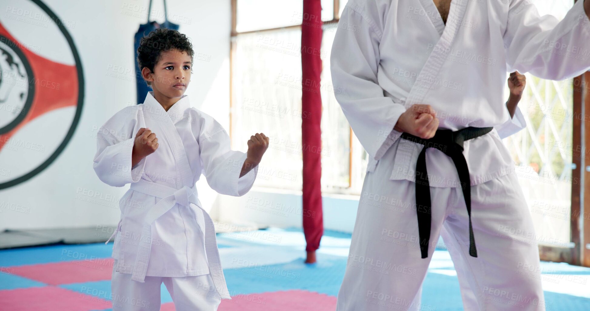 Buy stock photo Boy, lesson and sensei with student in karate class, self defense pose or martial arts with youth for combat education. Taekwondo training, stance and instructor with male child for coaching in dojo