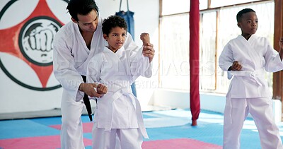 Buy stock photo Fitness, karate and sports with kids in dojo for combat, fighting or self defense training. Development, exercise or growth with children and teacher in class for martial arts lesson or practice