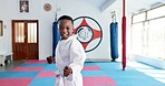 Karate, portrait and smile of boy child in dojo for combat, martial arts or sports training. Exercise, fitness and workout with happy African student in gym for education, development or growth