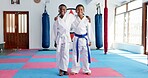 Hug, karate and portrait of children in dojo for martial arts, self defense or sports training. Development, fitness and smile of student friends embracing in class together for exercise or workout