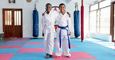 Buy stock photo Hug, karate and portrait of children in dojo for martial arts, self defense or sports training. Development, fitness and smile of student friends embracing in class together for exercise or workout