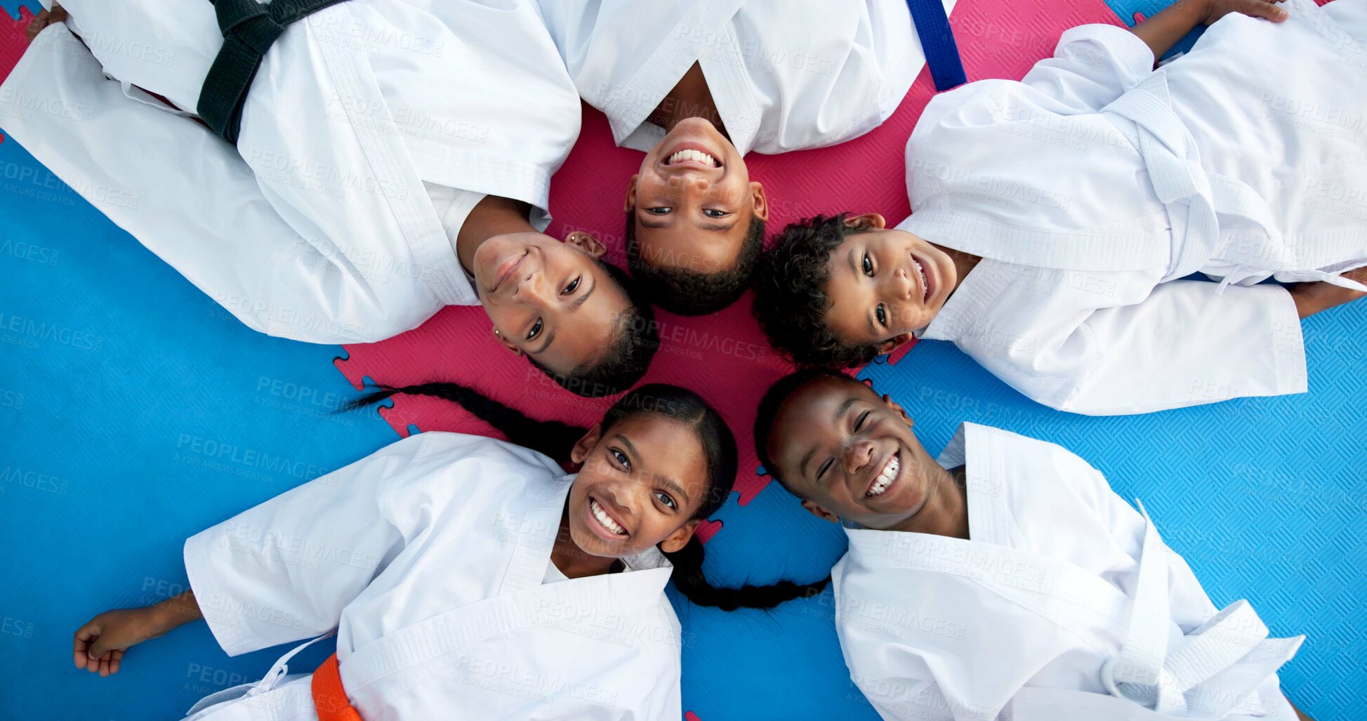 Buy stock photo Above, children and portrait with friends for karate, martial arts and training for self defense or fighting competition. Kids, smile and on floor for support, taekwondo challenge or community dojo