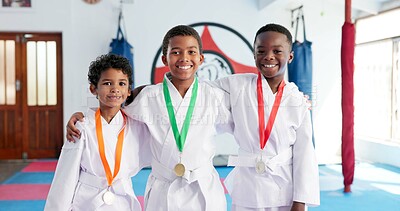 Buy stock photo Children, medal and portrait with hug for karate, martial arts training and self defense or fighting competition. Boys, prize and champion with support for taekwondo challenge or community dojo