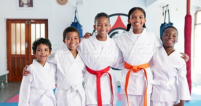 Buy stock photo Group, portrait and karate kids in dojo for combat, tournament or sports training with smile. Diversity, happy friends or children hug in gym for martial arts education, fitness or growth development
