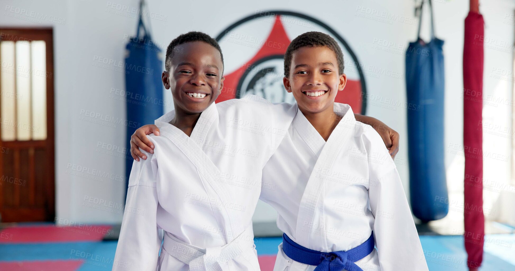 Buy stock photo Hug, karate and portrait of friends in dojo for martial arts, self defense or sports training. Development, fitness and smile of student children embracing in class together for exercise or support