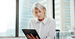 Reading, research and tablet with business woman in office for accounting, development or reporting. App, data and finance with mature accountant in workplace for budget or wealth management