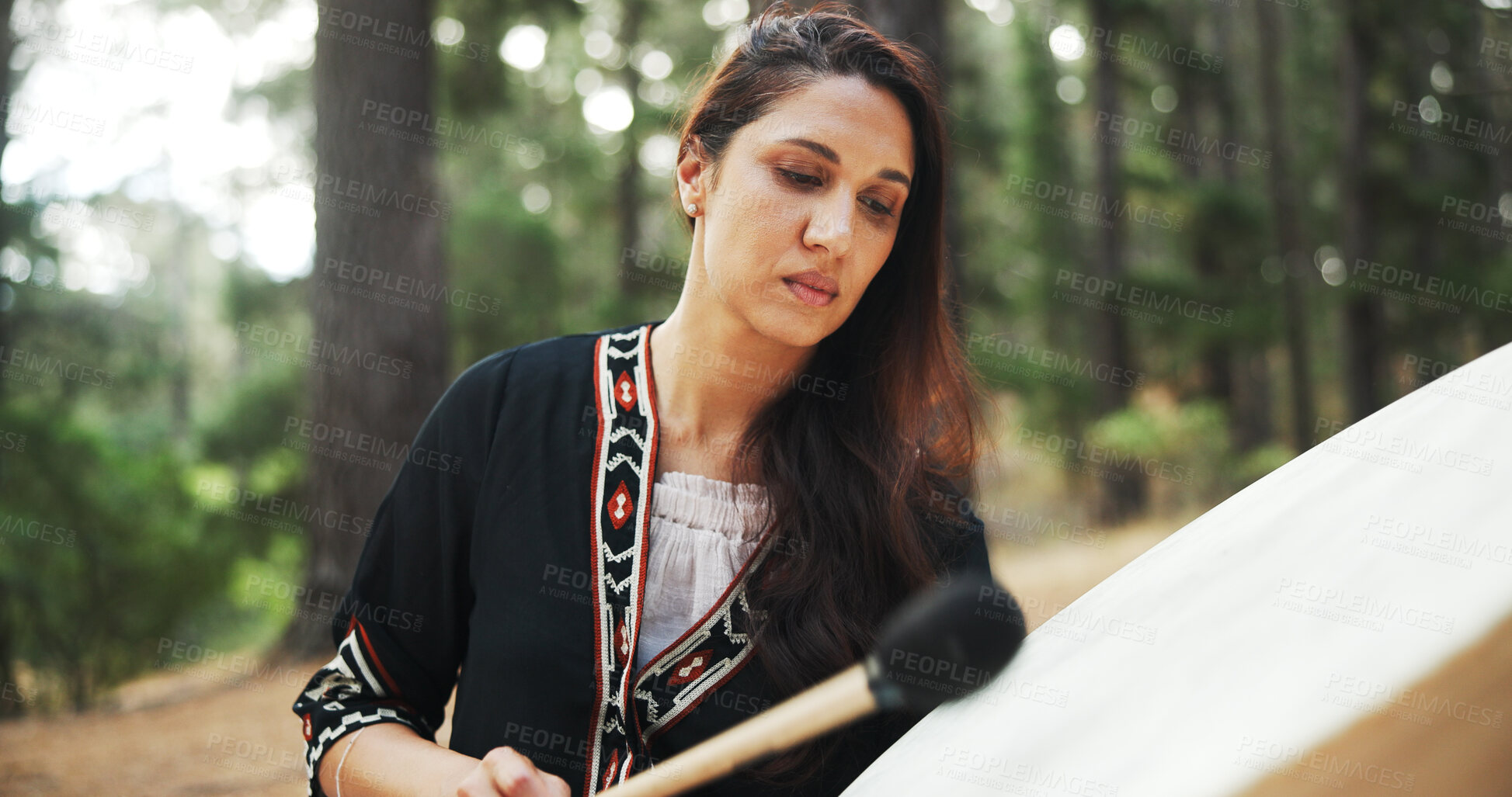 Buy stock photo Outdoor, woman and shaman with drum for sound, spiritual healing and traditional performance. Nature, female person and healer with music for holistic therapy, wellness and ritual practice in woods