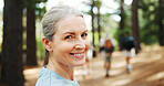 Hiking, nature and portrait of mature woman with smile for exercise, workout and walking for wellness. Fitness, travel and person in forest and woods for trekking, adventure and journey outdoor